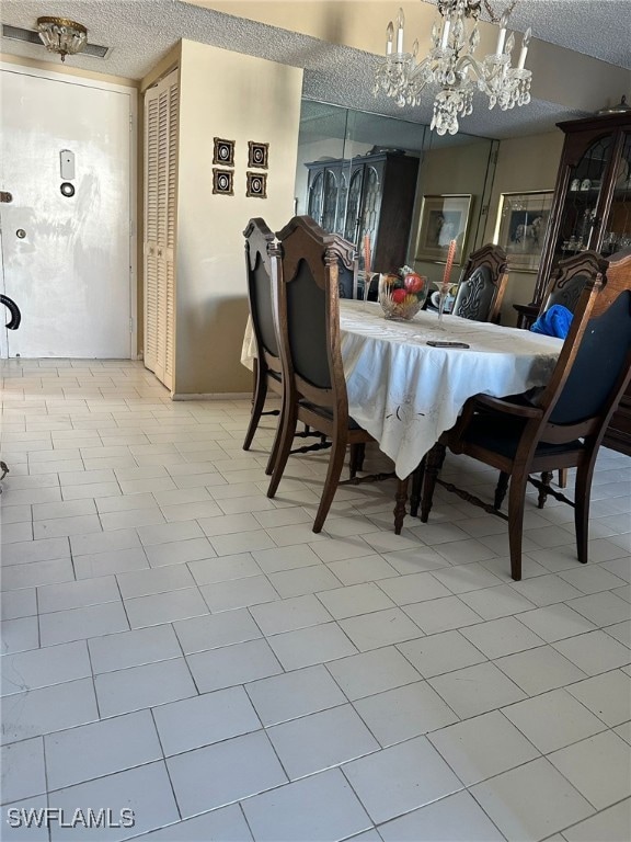 Dining room featuring a textured ceiling and a not