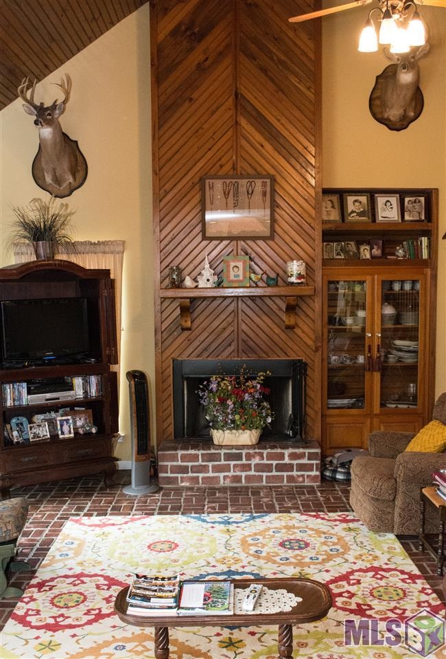 Cozy living room with cathedral ceilings.