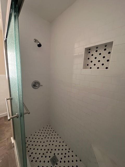 Bathroom featuring tiled shower