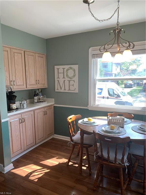 Kitchen featuring laminate flooring and serving/bar station