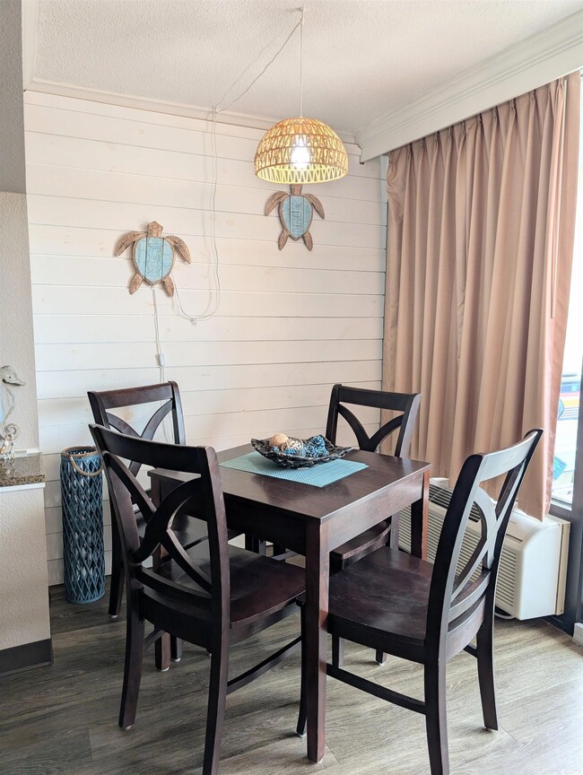 Dining room with hardwood / wood-style floors, woo
