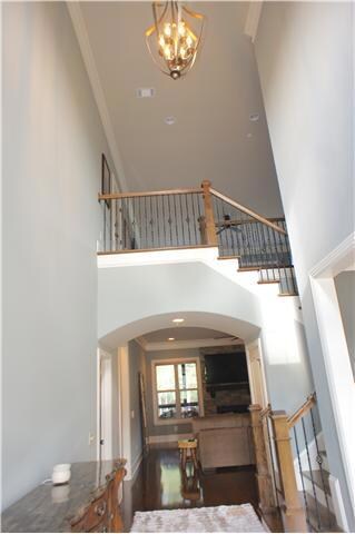 Enter the home through the double front door in to the 2 story foyer with archway.