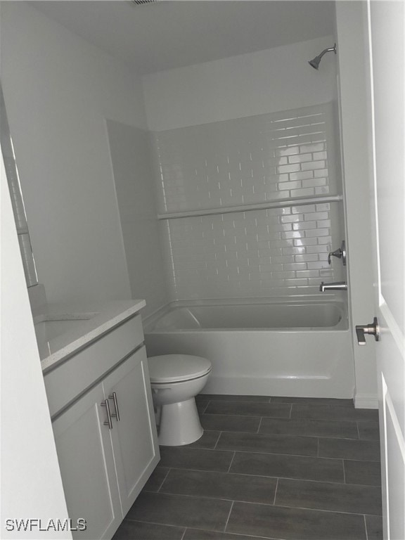 Full bathroom with vanity, wood finish floors, toi