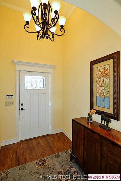 Vaulted Entry with hardwoods.