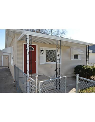 Facade/Exterior Front. Covered front porch with pa