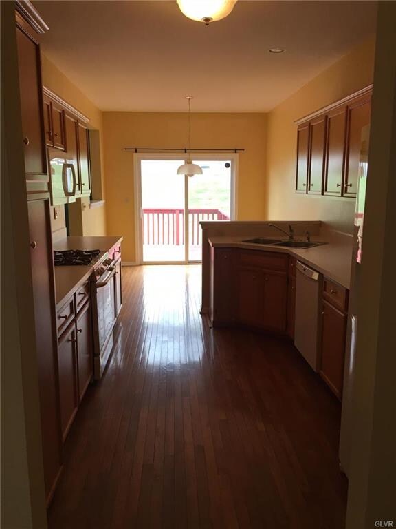 Kitchen area with hardwood floors