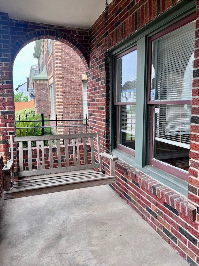 Lovely front porch featuring a cozy swing for rela