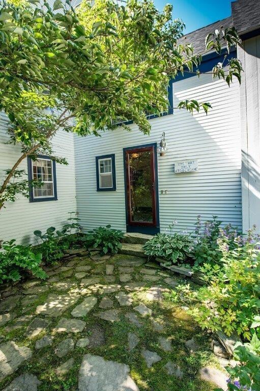 The mudroom entry is lined with...