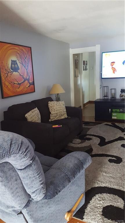 Apt #1, Living room with more living space/entry w