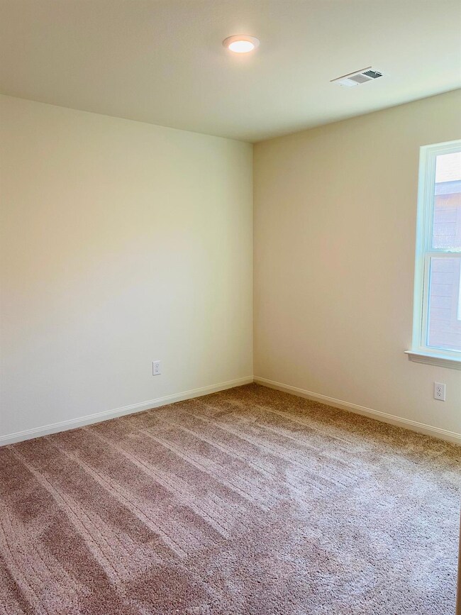 Unfurnished room featuring carpet flooring