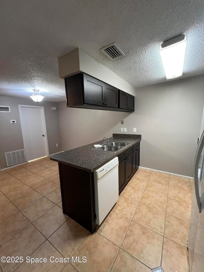 8716 Hibiscus Ct, Cape Canaveral, FL 32920 - photo 7