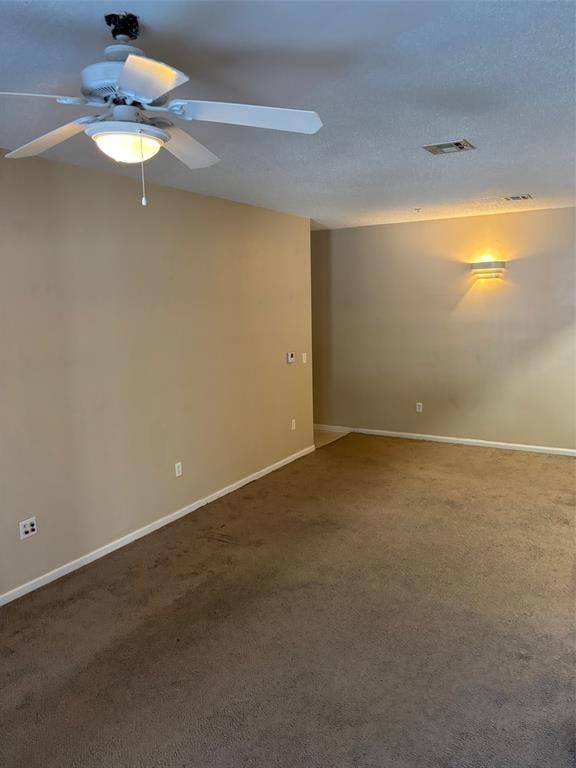 Living room featuring a ceiling fan and carpet flooring