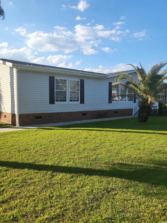 View of front facade featuring a front yard and cr