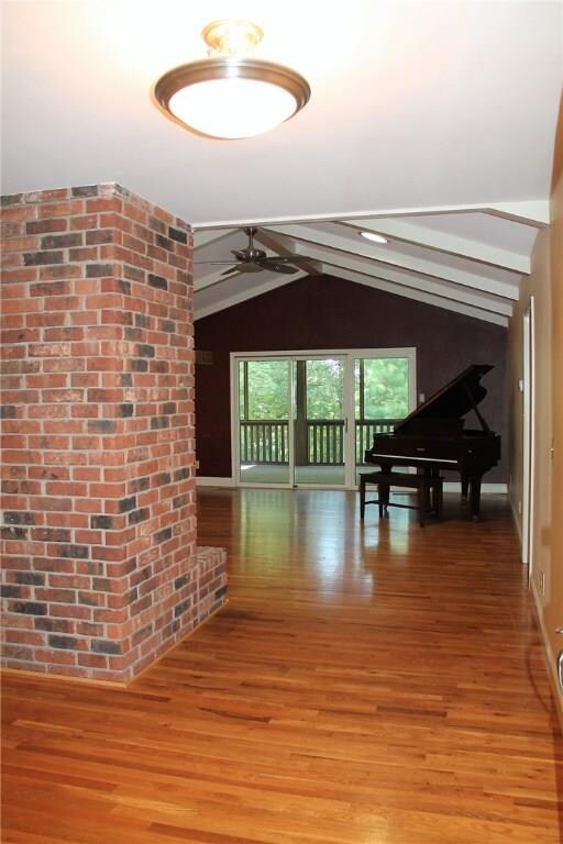 Entryway, screened in porch at the back, master bedroom on the right, to the left, stairs to basement, and hallway leading to bathroom, garage, kitchen