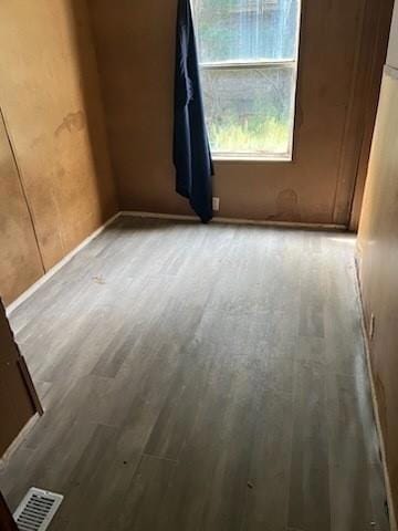 Unfurnished bedroom featuring wood finished floors