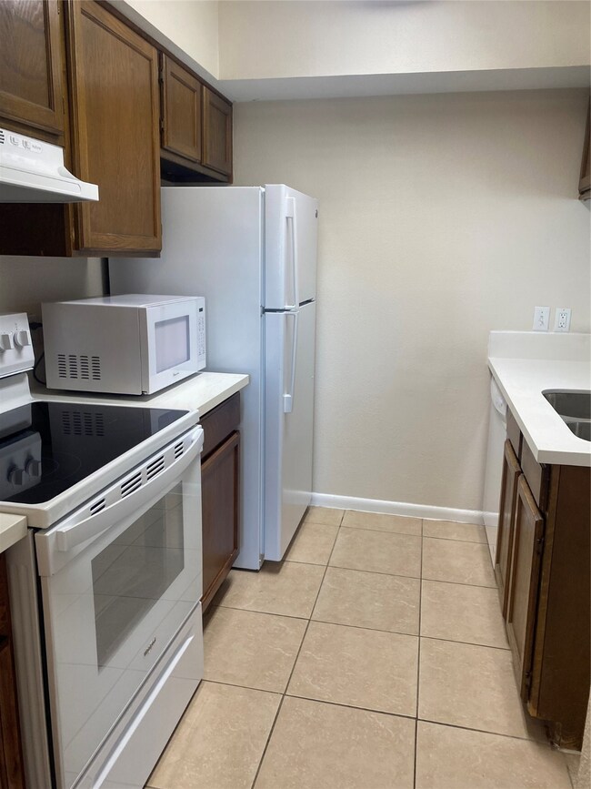 New refrigerator, electric range and Quartz counte