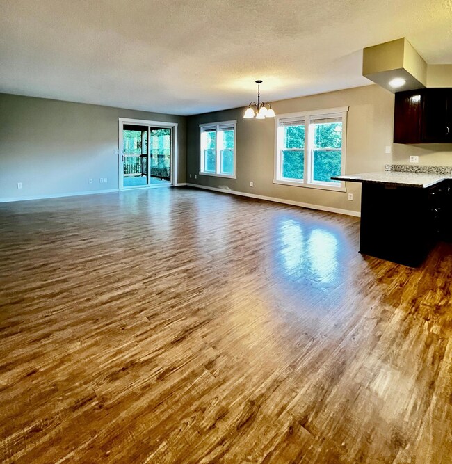 Open concept main floor living, dining and kitchen space!