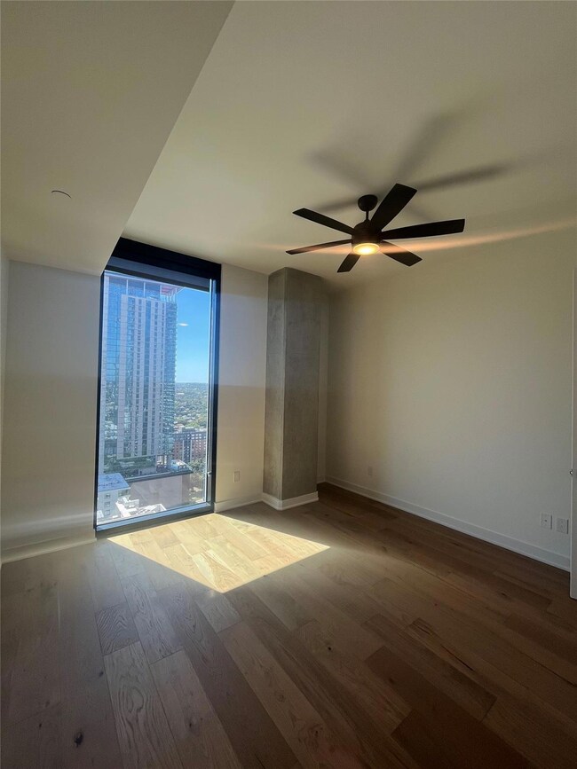 Unfurnished room with wood finished floors, ceili