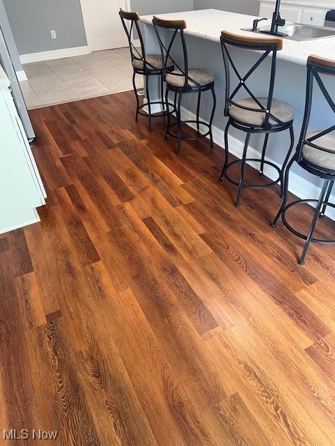 Detailed view of a sink and wood finished floors