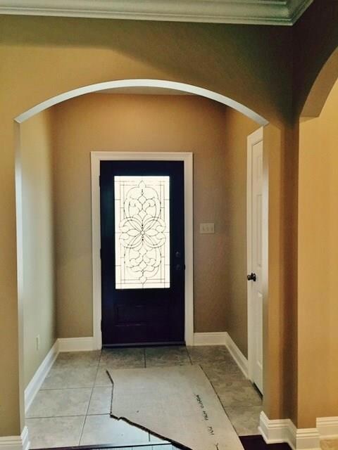 Pretty beveled glass door and attractive arches gr