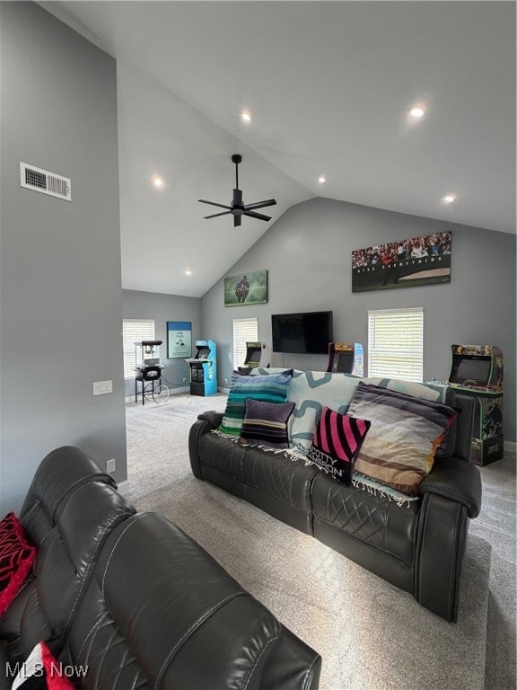 Living room featuring carpet floors, high vaulted ceiling, ceiling fan, and recessed lighting