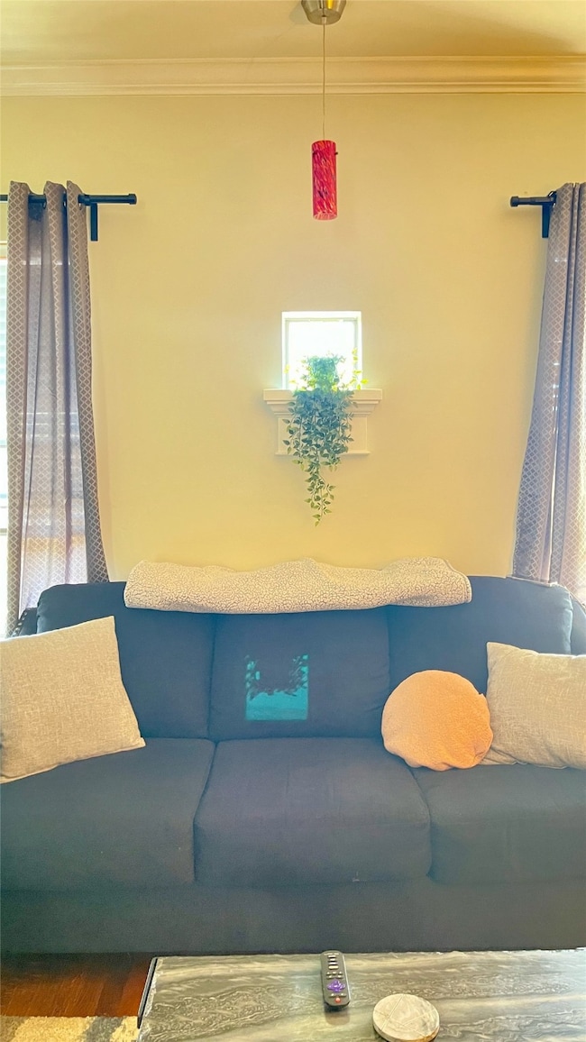 Close up of small alcove window featuring decorative lighting in the living room.