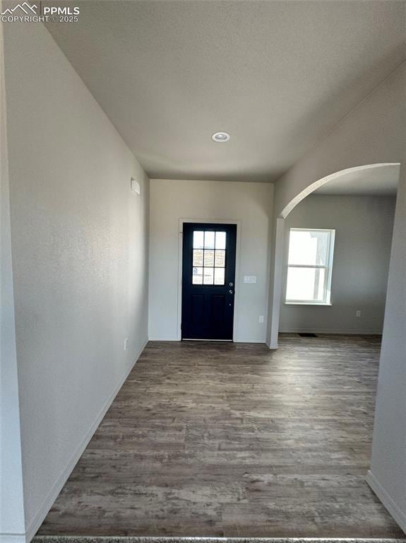 Entrance foyer with hardwood / wood-style floors