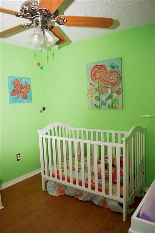 Second bedroom with laminate flooring.