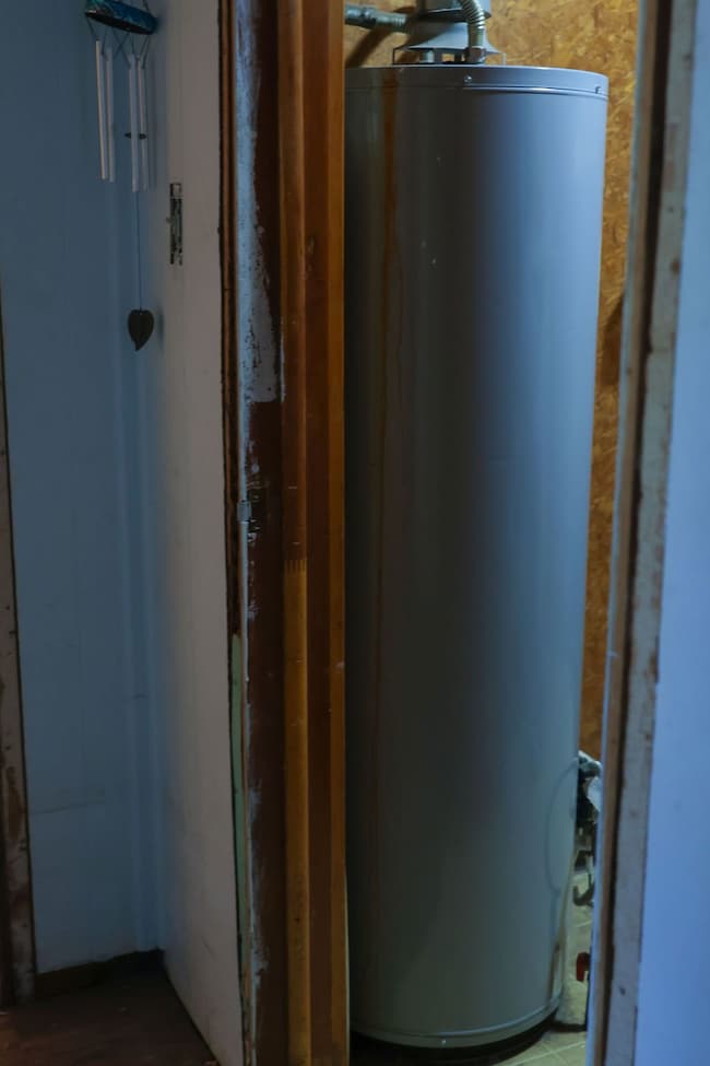 Utility room featuring water heater