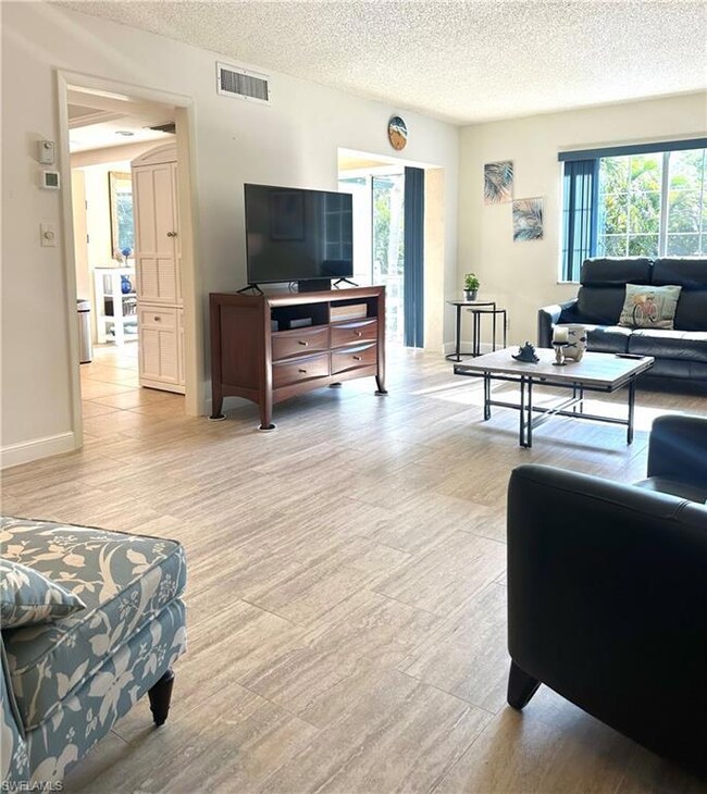 Living room featuring plenty of natural light, lig