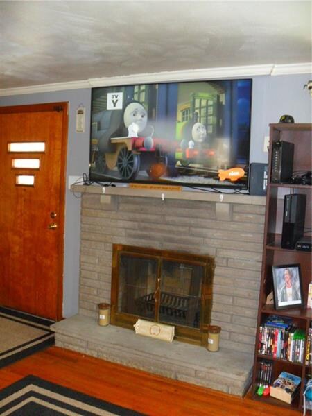 The fireplace adds an attractive decorative detail