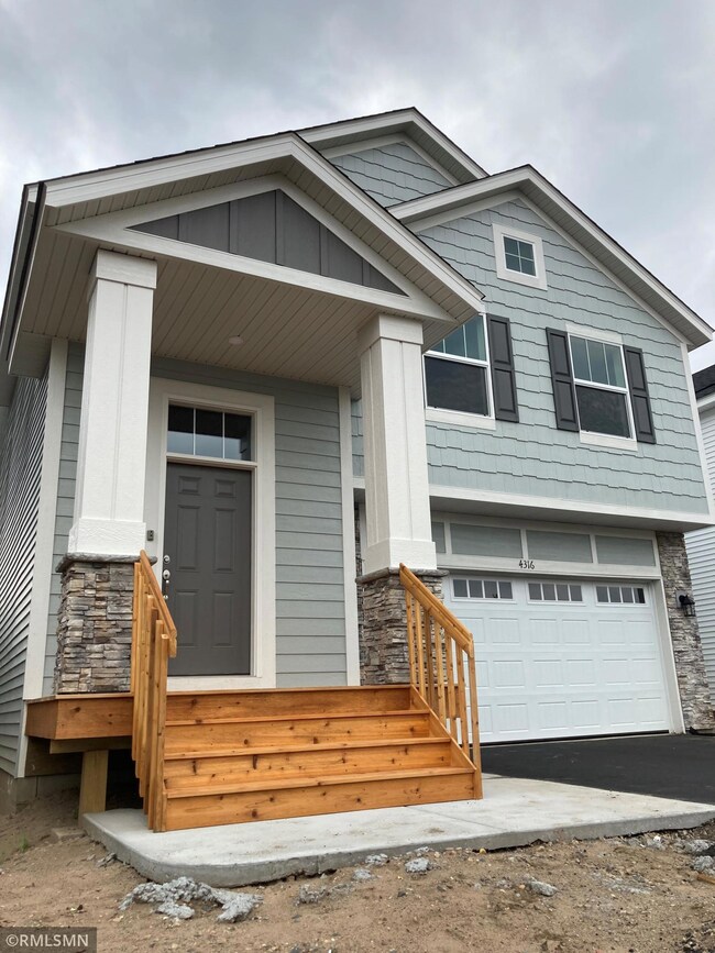 Highlighting the textures, colors, and covered front porch! The character of this home shines from the first impression to the last!