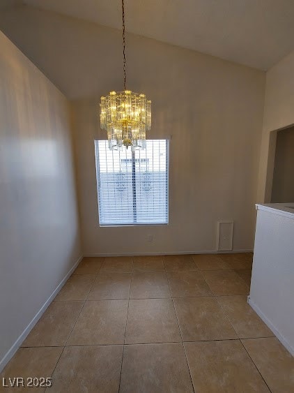 Unfurnished dining area featuring light tile patte