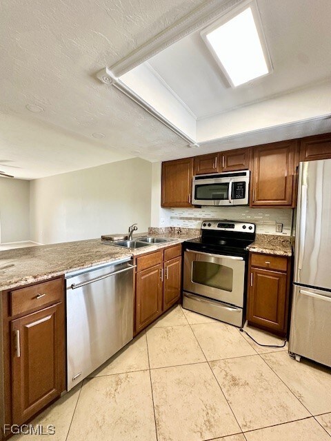 Kitchen with stainless steel appliances