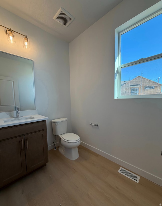 Bathroom featuring vanity and light wood-type flooring