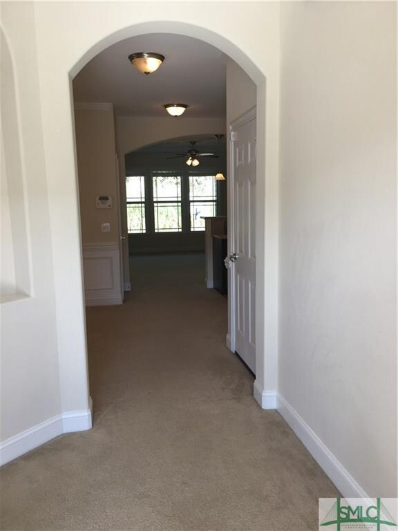 Arched doorways and niches throughout.
