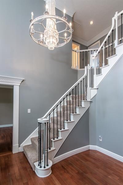Grand 2 story entry enhanced by the new chandelier
