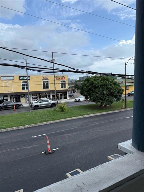 Brand new paved road to Whole Foods one way and Tr