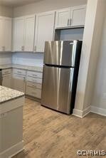 Kitchen with white cabinets and stainless steel fr