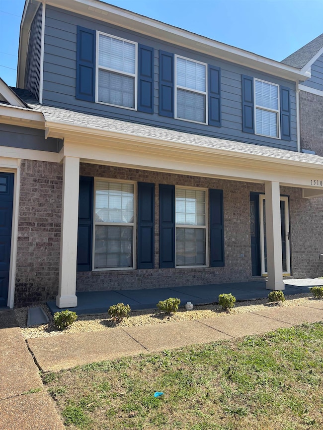 View of front of house featuring covered porch and
