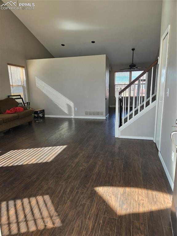 Unfurnished living room featuring ceiling fan and 