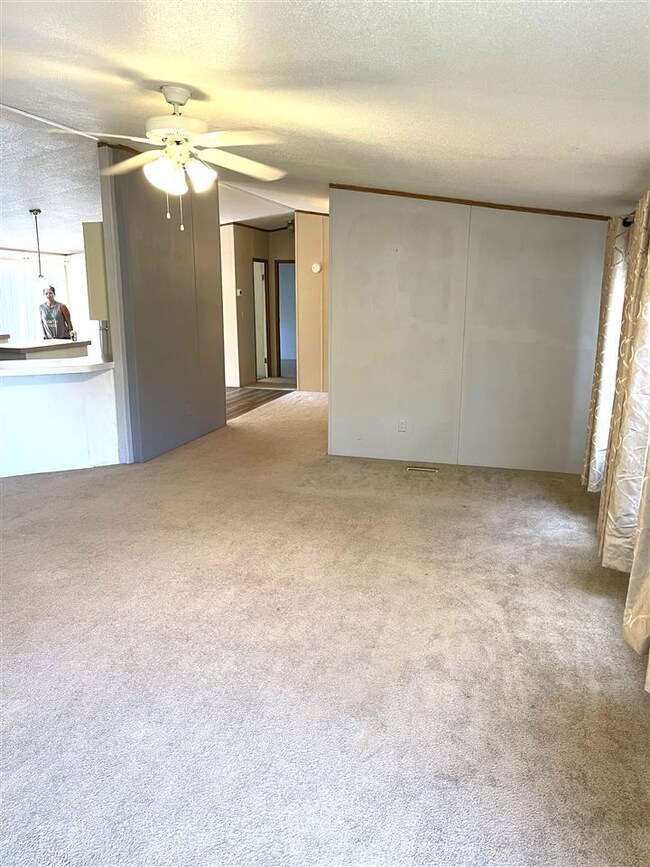 Living room is open to kitchen and formal dining r