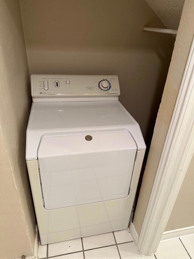 Clothes washing area with washer / clothes dryer a