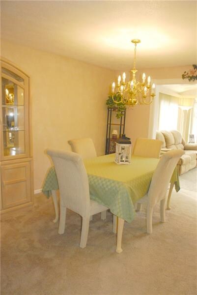 Gorgeous dining area with updated light fixture.