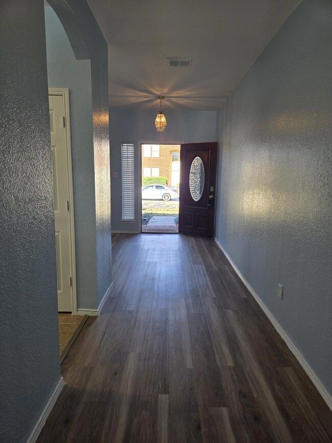 Entryway featuring dark wood-type flooring and an 