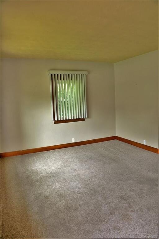 Living room with updated carpet.