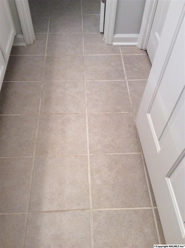 BOTH full baths have this nice neutral tile in them recently added by the seller.