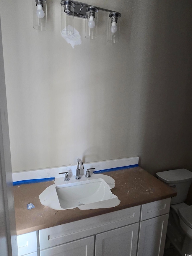 Bathroom with vanity and toilet