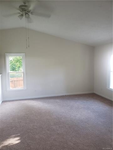 Family room with cathedral ceiling.