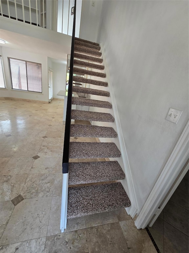 Stairs to the loft and primary bedroom